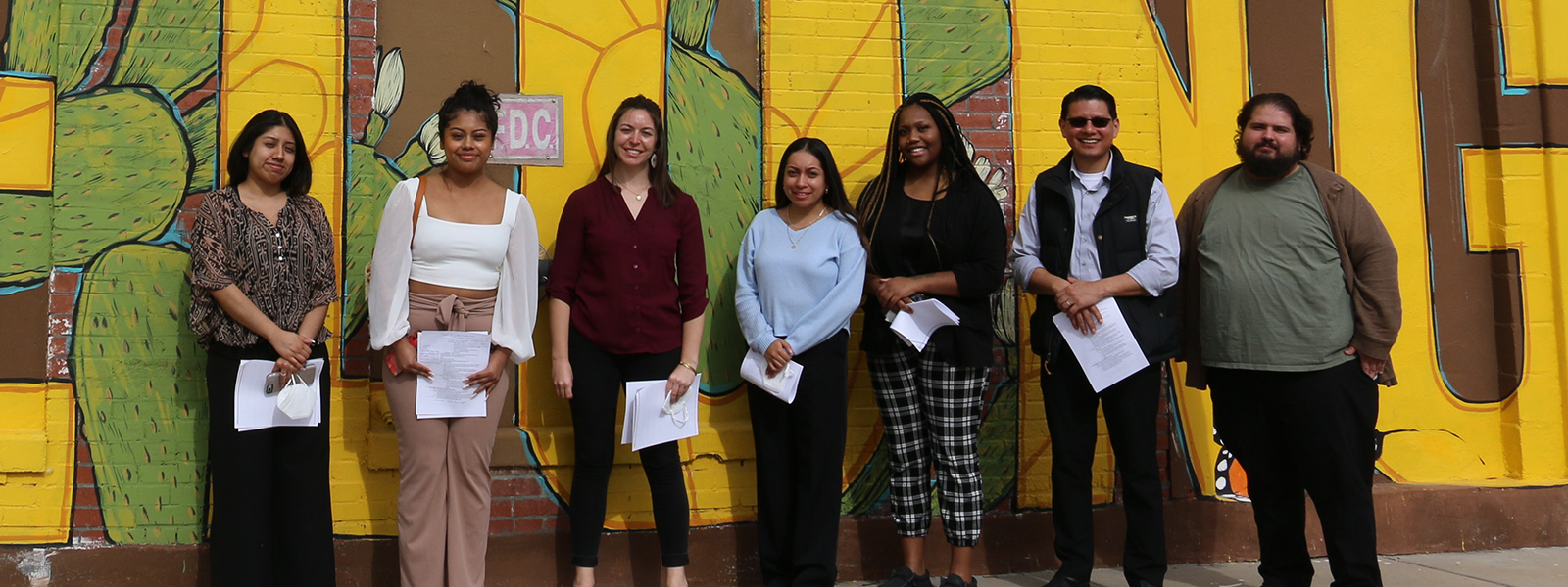 Students in front of mural 