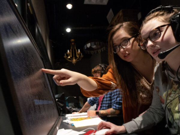 Student and Professor looking at computer screen