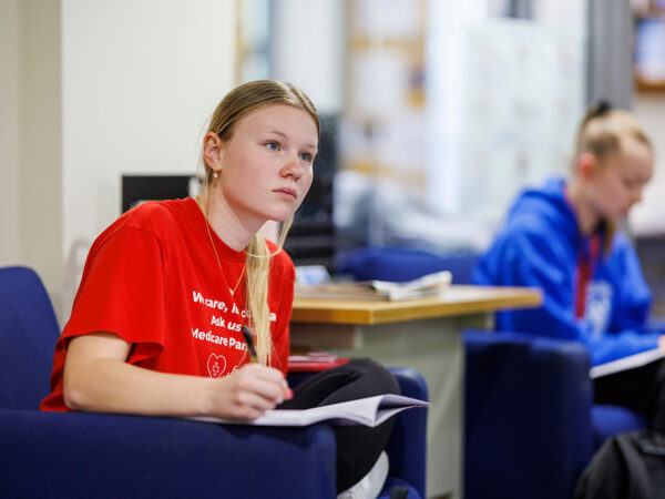 student taking notes