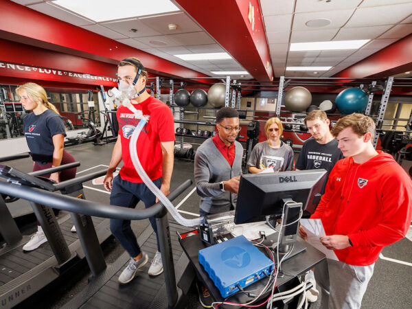 a group of people in a gym