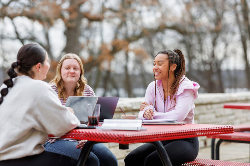 a group of women sitting at a table