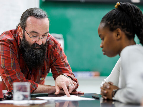 professor teaching a student