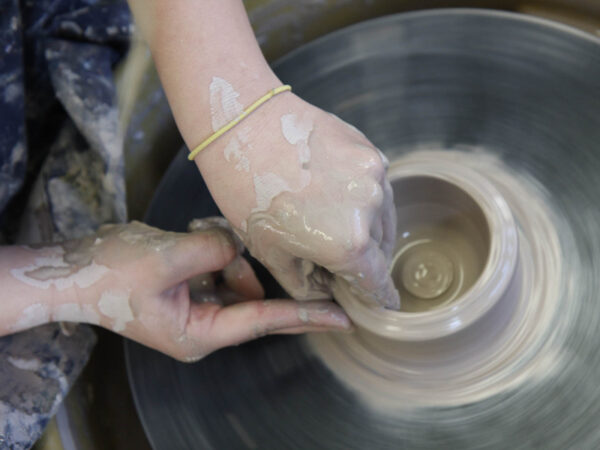 a person working on a pottery wheel