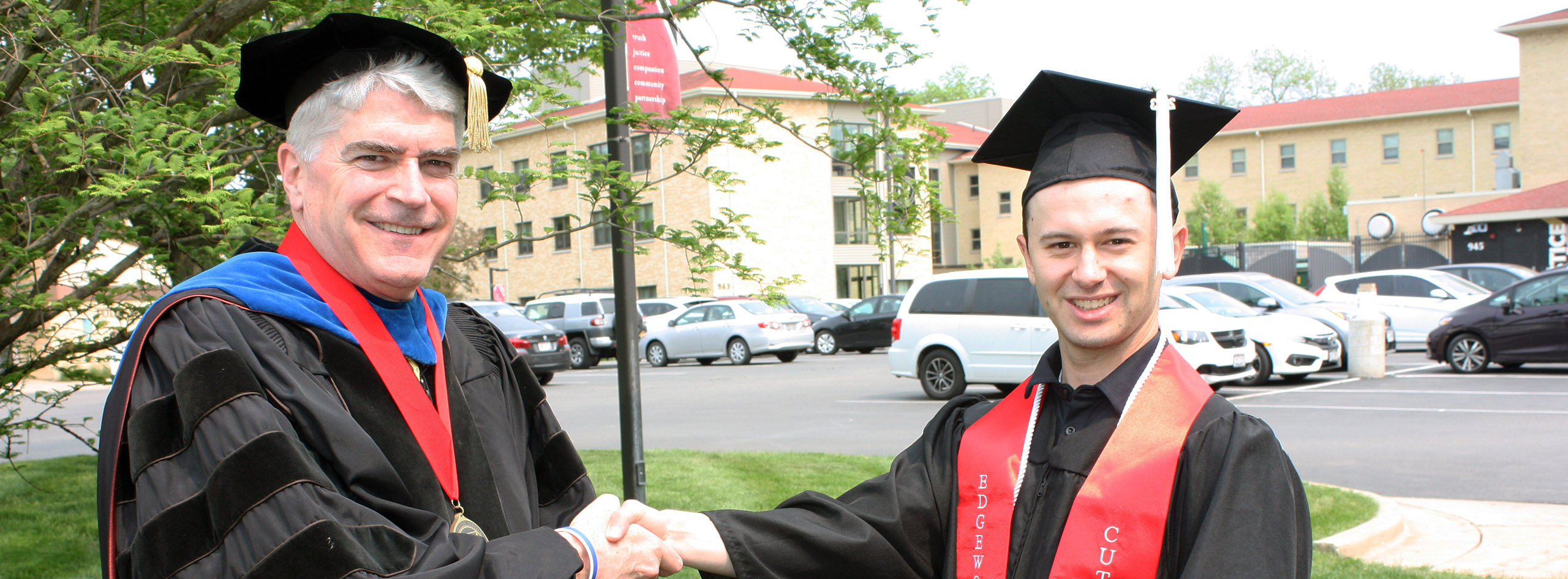 Nathan Berge and Andrew Manion shake hands