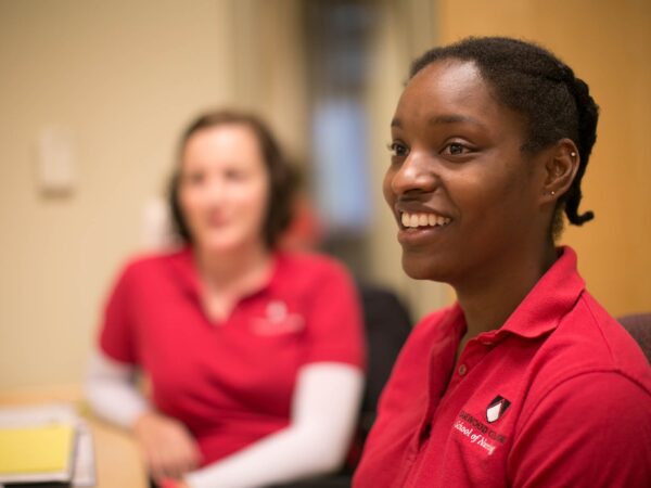 two nursing students smiling