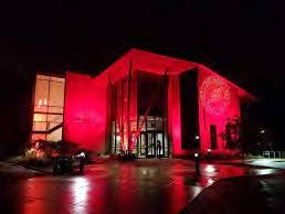 a building with red lights at night