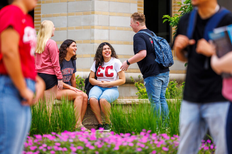 a group of people sitting on a bench